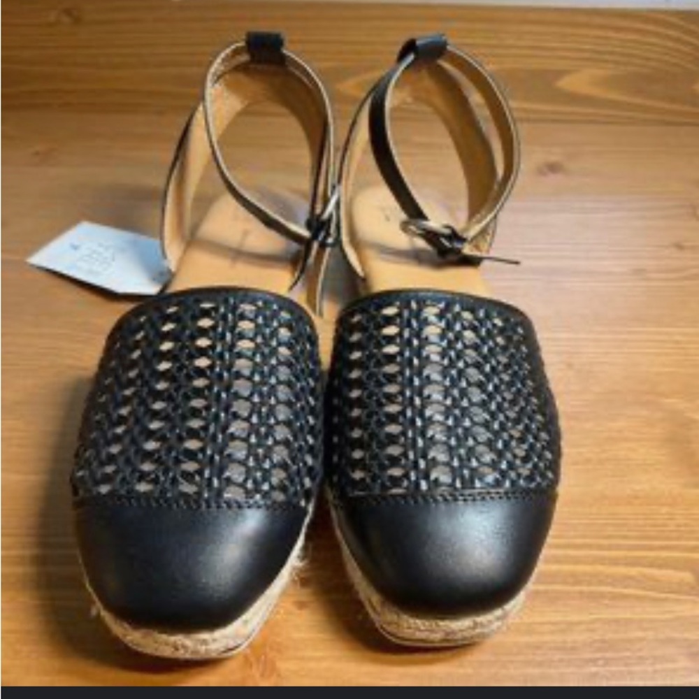 Black flat footed sandals